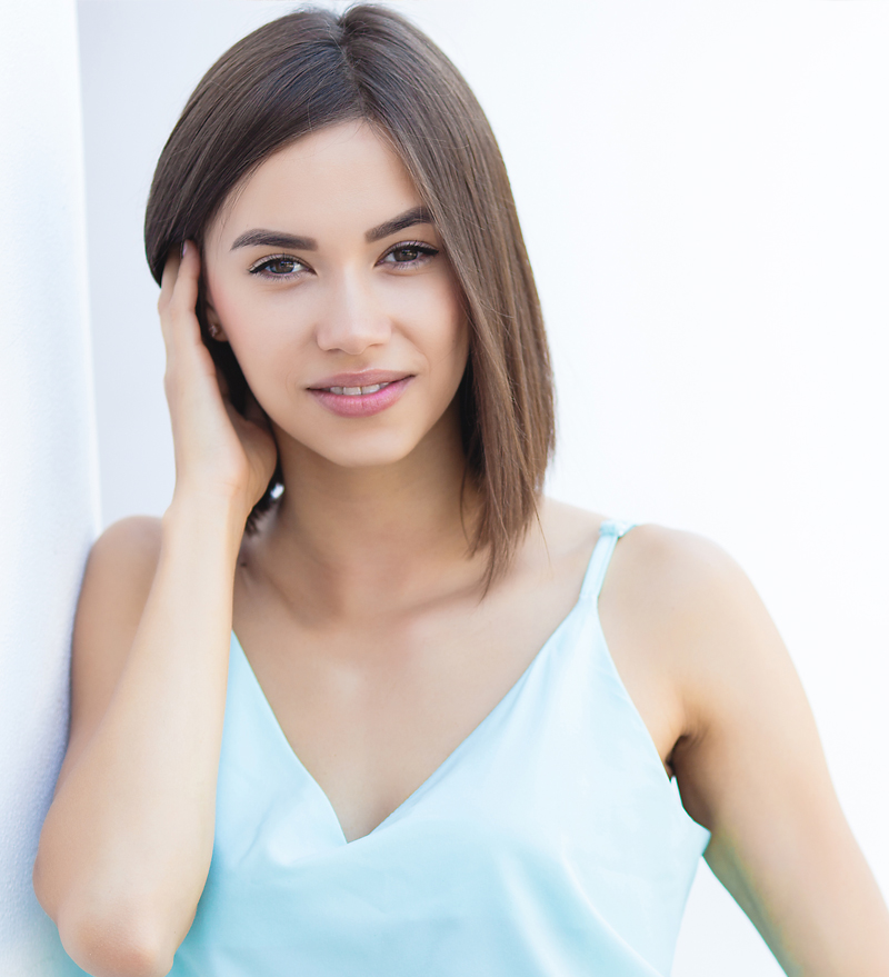 short haired woman with blue top