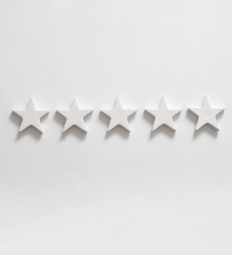 Customer experience. Service rating and review. Assessment survey. Five star shapes. Copy space on white background.